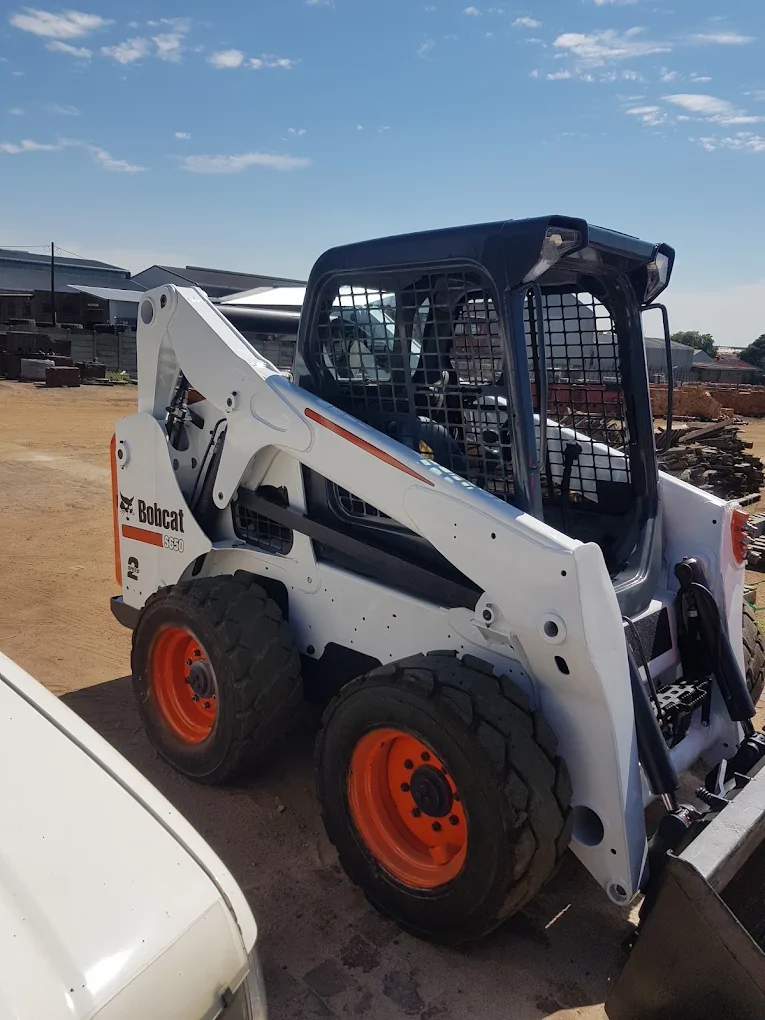 Skid-steer loader at work in the materials yard